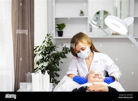 A professional portrait of a dermatologist